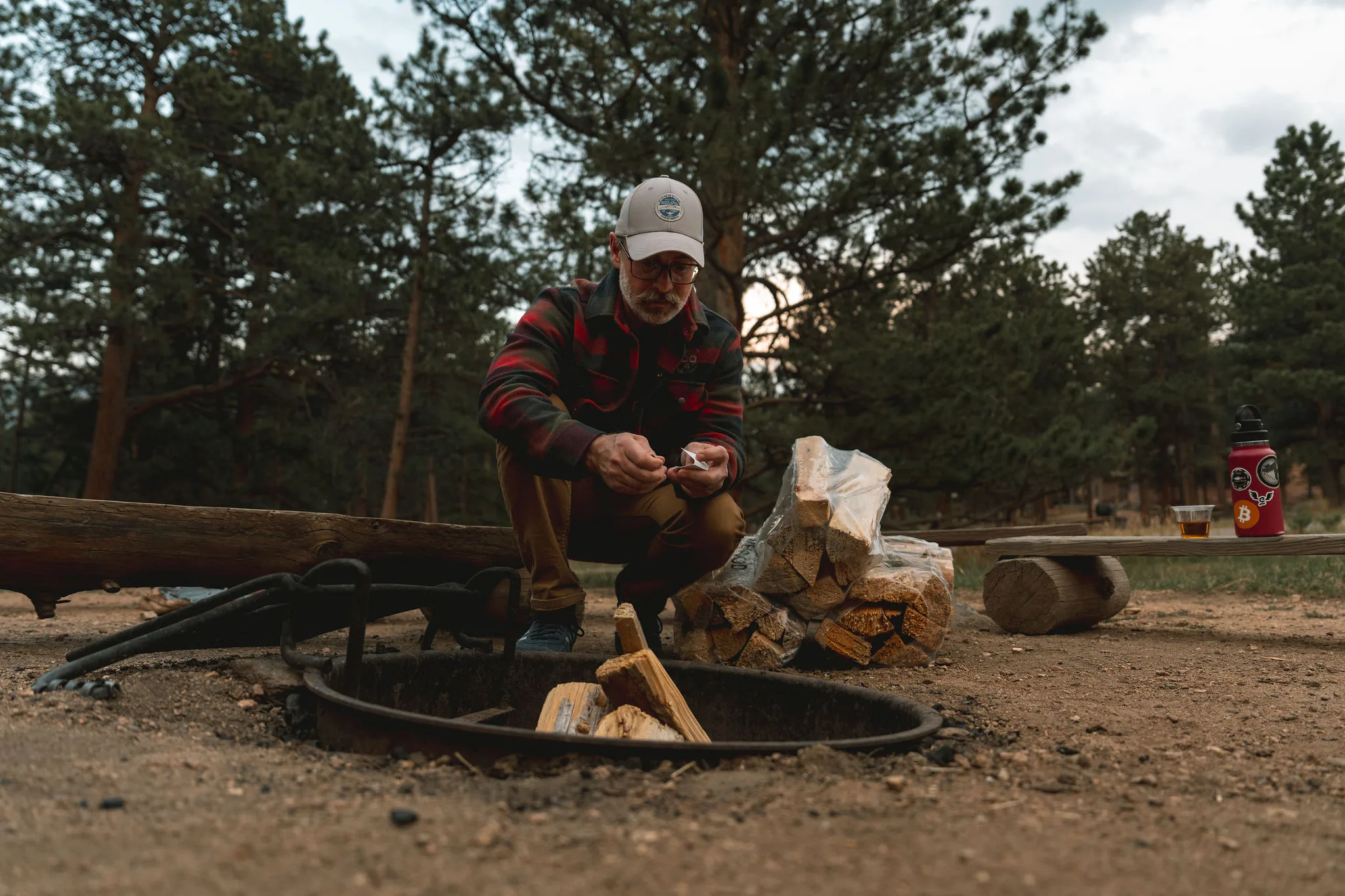 Man lighting a campfire
